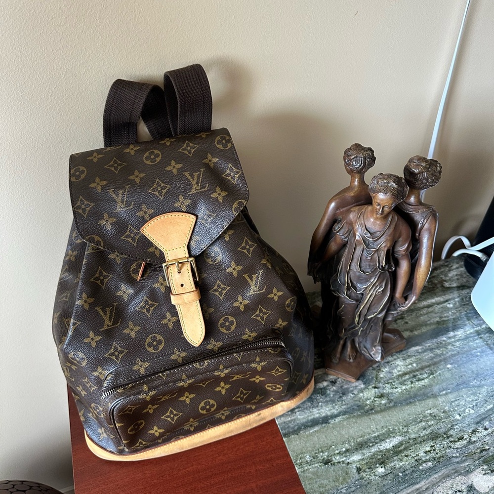 Used Louis Vuitton Monogram Backpack  SP0055.Drawstring . One front zip pocket.